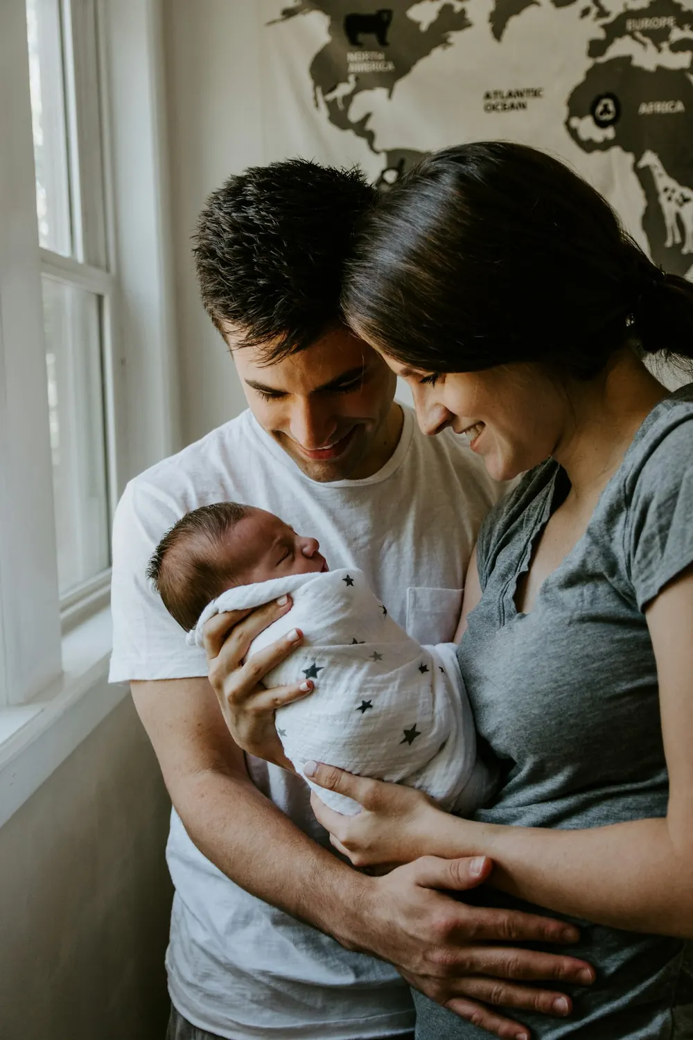 Parents holding their newborn child