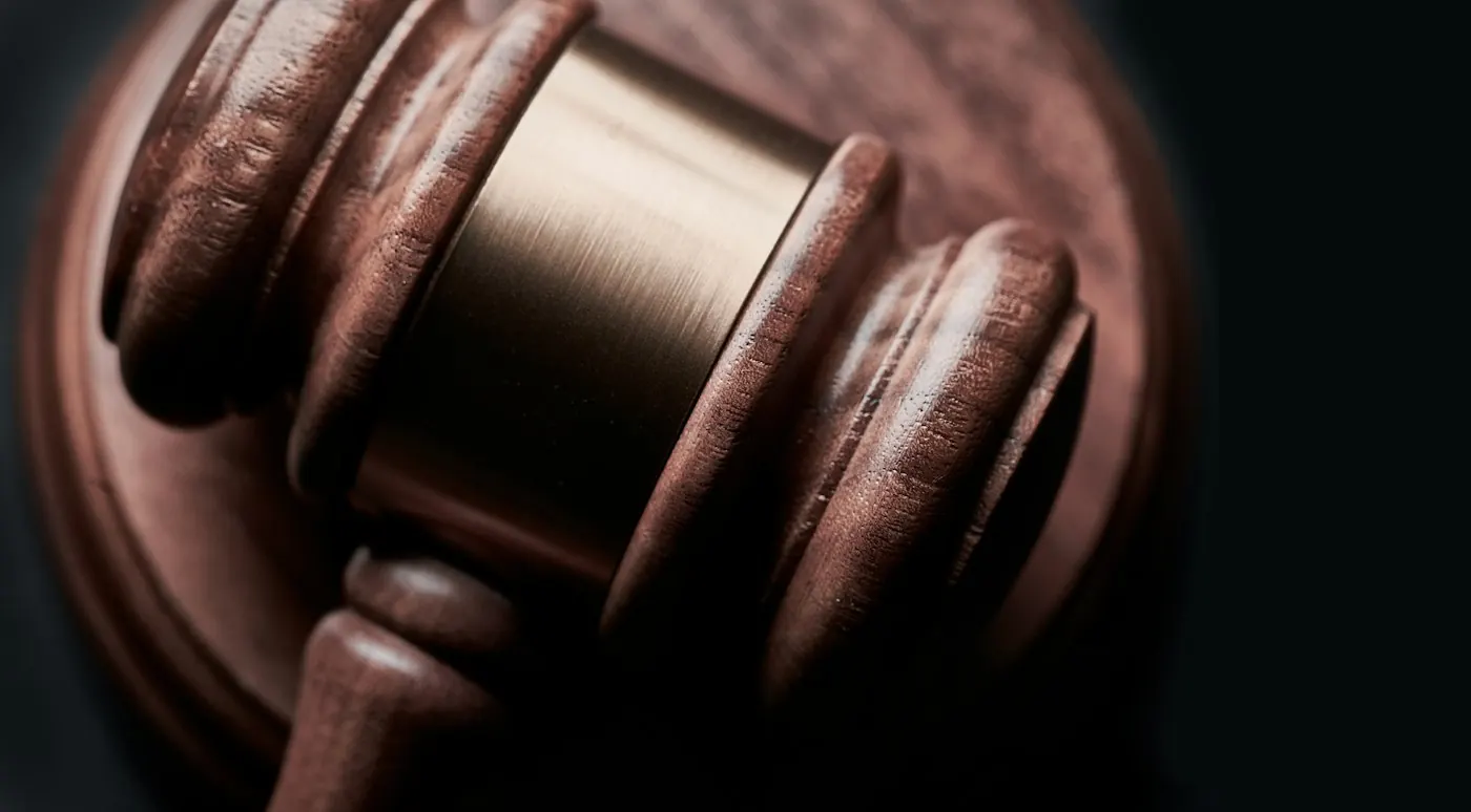 A judge’s gavel in low light