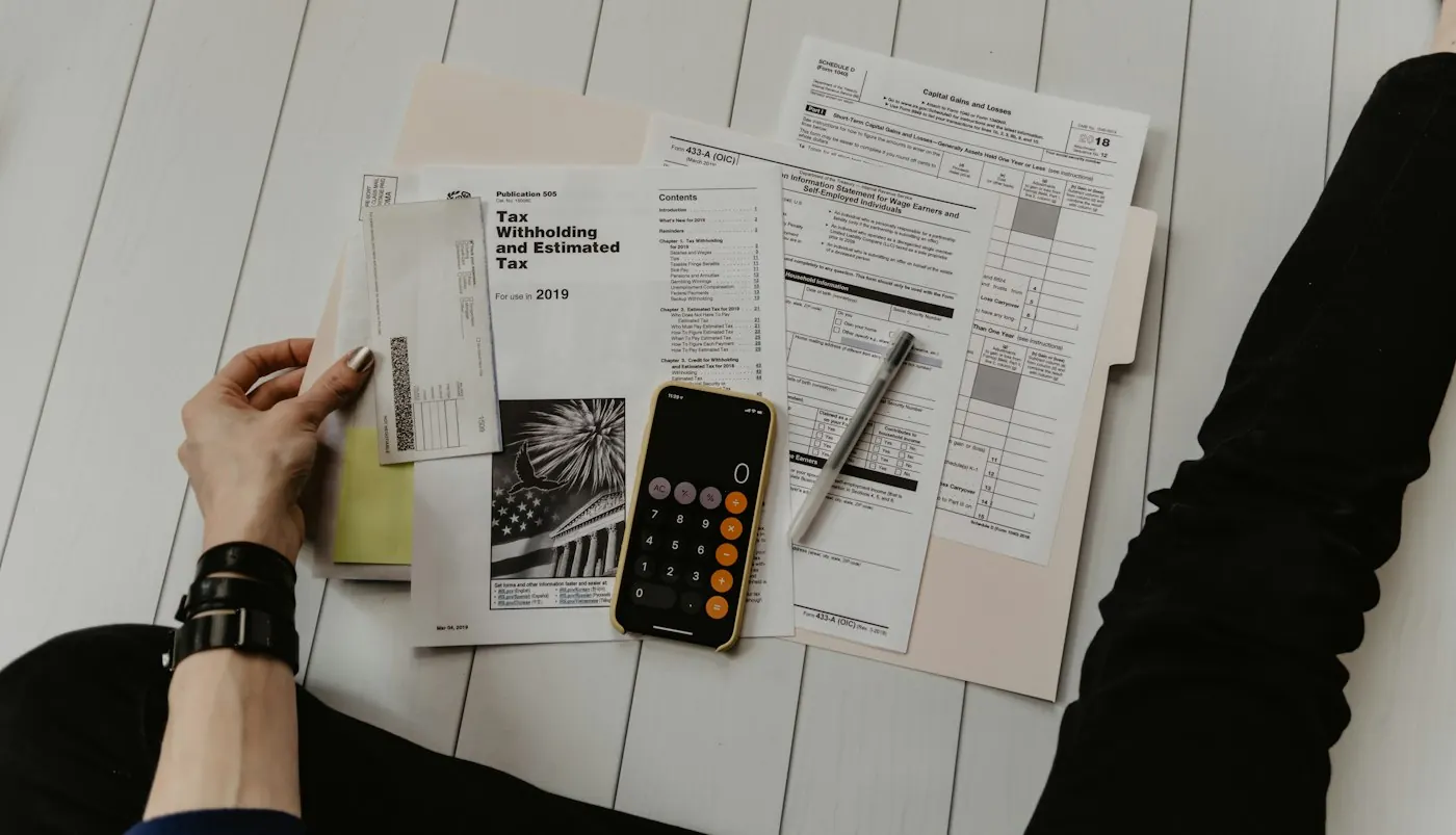 Financial statements and a calculator on a desk